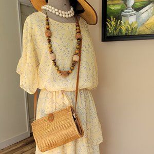 Delicate light yellow tiers dress
